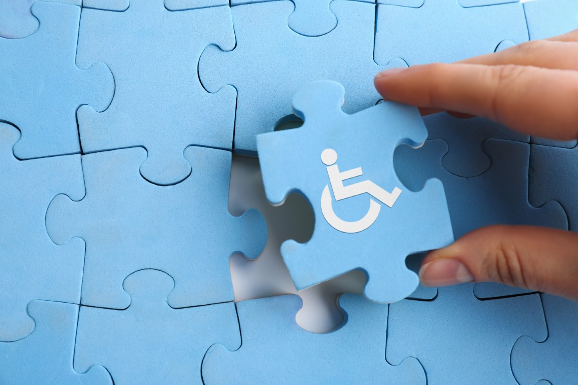 Inclusion,Concept.,Woman,Putting,Light,Blue,Puzzle,With,International,Symbol